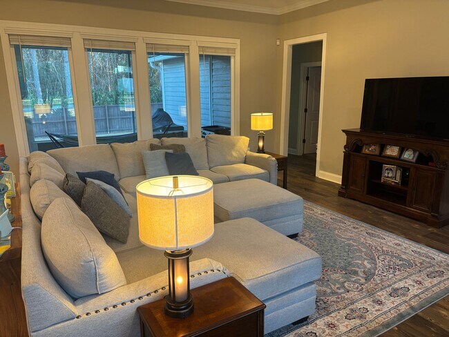 Photo - Spacious 4BR/3BA Creekside West Home with Screened Porch, Fenced Yard & 3-Car Garage