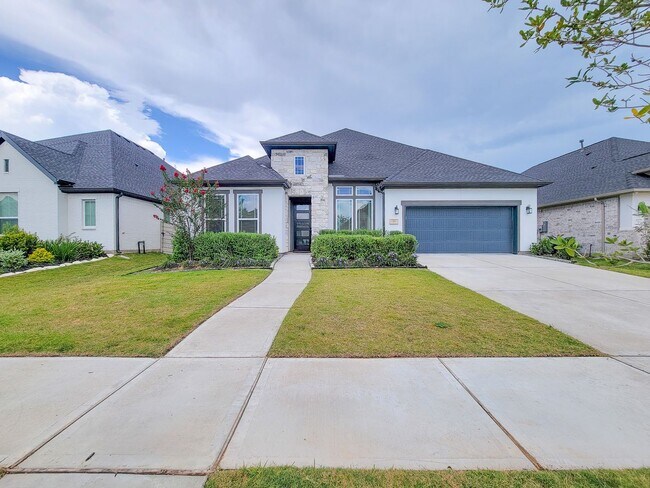 Photo - Beautiful New Home in Manvel, Texas featuring 4 spacious bedrooms and 3.5 bathrooms with 3 car ga...