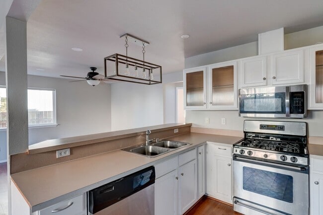 Photo - Spacious 4-Bedroom Home with Cozy Backyard...