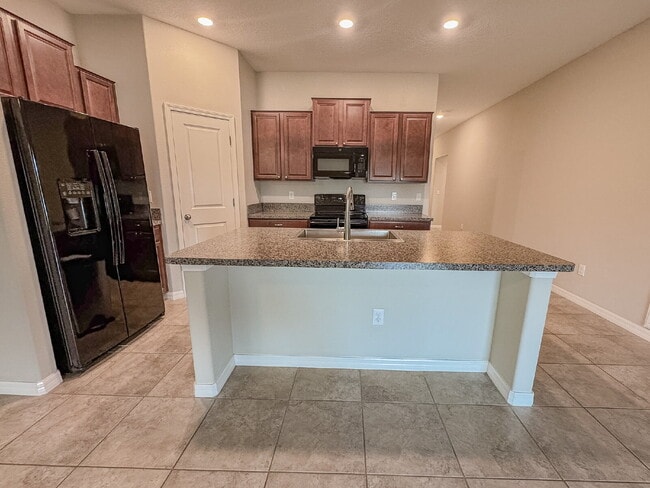 Photo - "Charming 3-Bedroom Home with Elegant Granite Touches in Wimauma!" Community pool! Fitness center...