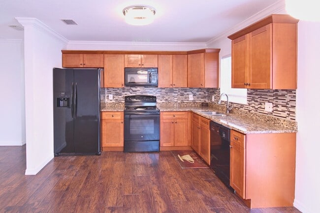 Photo - Charming Renovated Tampa Home with Fully Fenced Front & Backyard