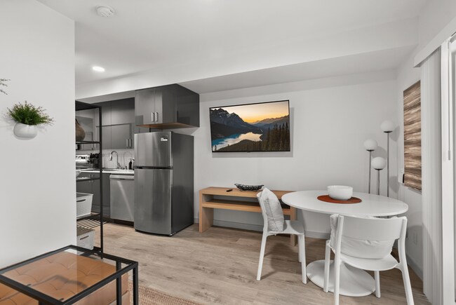 Open-concept kitchen and dining area with modern finishes.
