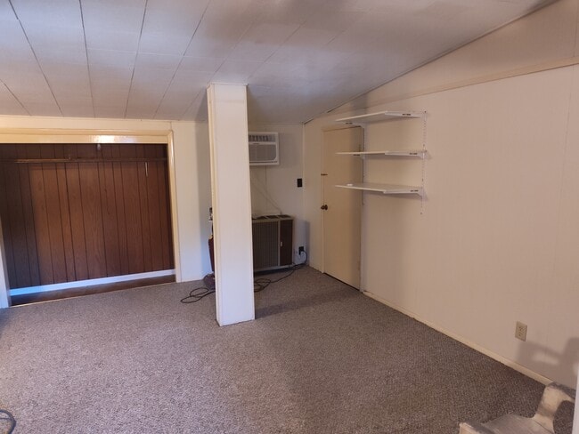 Bedroom area looking into closet