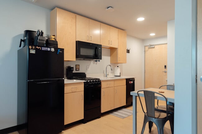 E1 Studio A (occupied photo) - The Elements