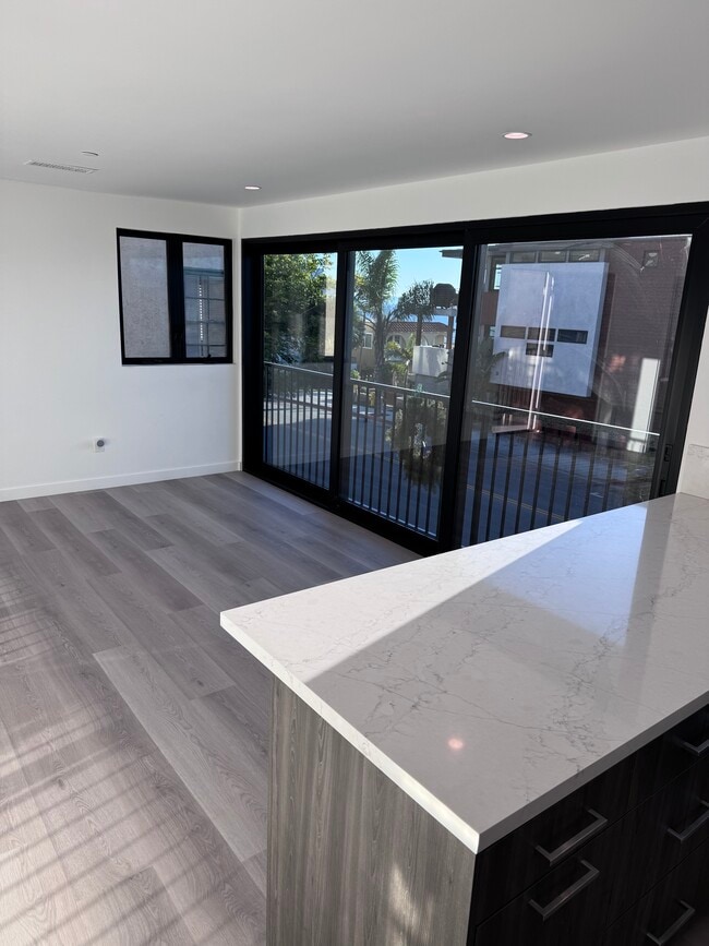 Kitchen looking out to south view slider closed - 2408 Highland Ave Unit A