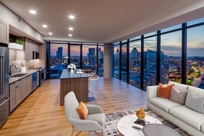 Penthouse-level Signature Collection apartment homes living/dining areas with hard surface flooring throughout