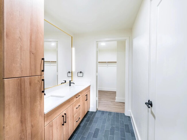 Double vanities, and quartz countertops elevate your daily routine.