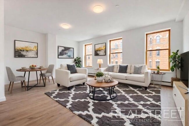 Photo - Full-Floor Renovated 2BR | Expansive Living Space | 1 Min to A Train Unit 3