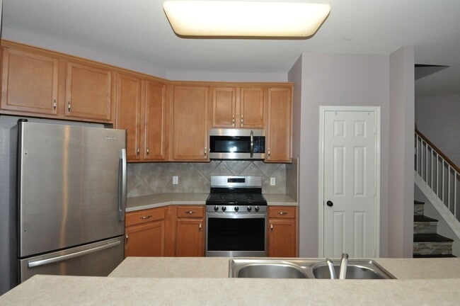 Photo - All appliances included! Gated lock and leave condo community in North Austin