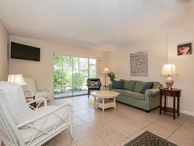 Living Room Opening to Screen Porch - 1901 Indian River Blvd Unit D-103