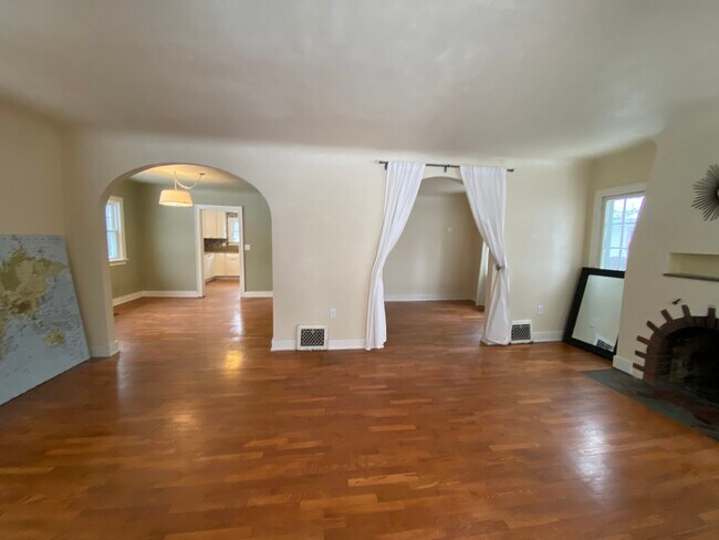 Beautiful arches leading into the dining room and bonus room! - 421 E Ash St