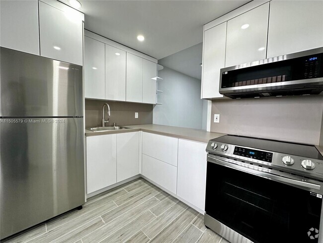 Building Photo - New World Condo Unit 212