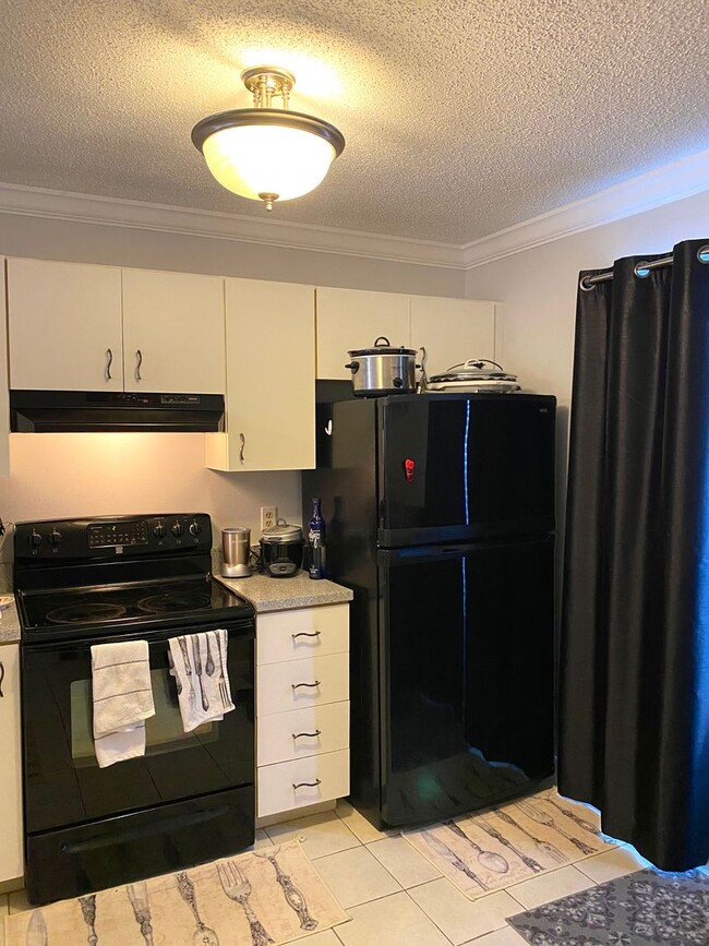 Photo - Romantic 1BR/1BA Top-Floor Condo with Garden Tub & Scenic Balcony Views – Dockside Orlando Unit 203