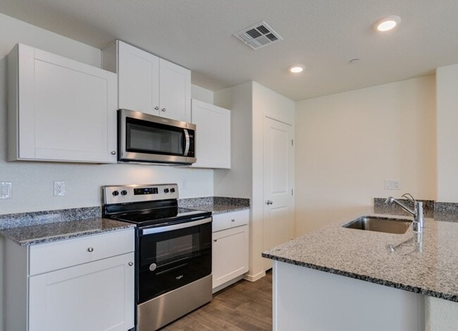 Photo - New townhome with attached 2 car garage.