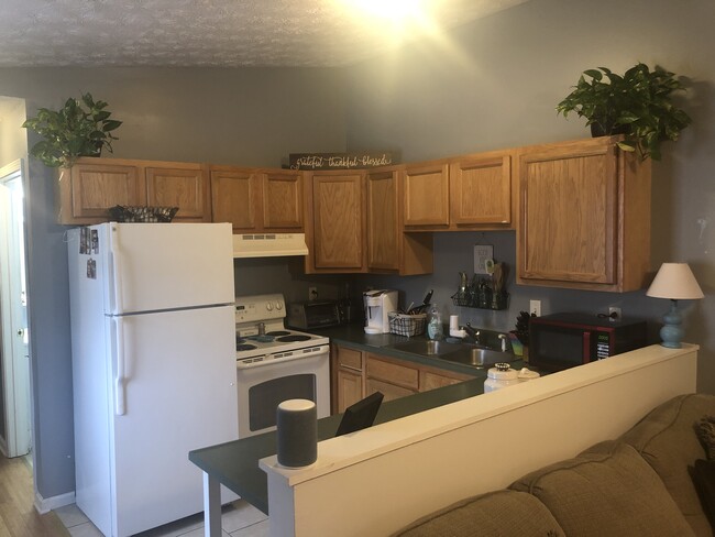 Kitchen with dishwasher - 632 Hal Greer Boulevard Apartments