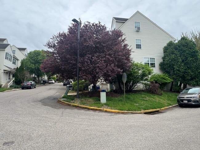 Photo - Stunning 3–4 Bedroom Townhome in Private Community | Garage + EV Charger | Deck with Tree Views