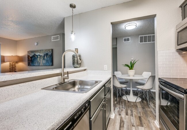 Dallas Apartments – Open Kitchen with Bar Seating & Dining Area