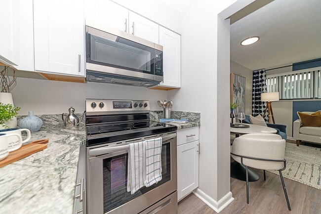 Kitchen with granite counters, stainless appliances, and modern cabinetry