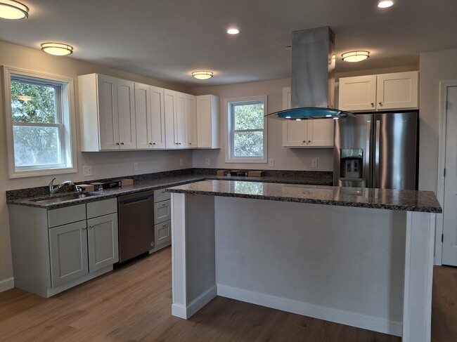 Kitchen with island - 103 Brook St Apartments