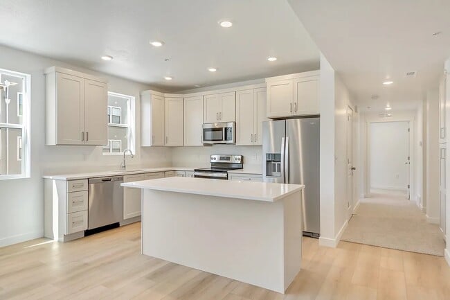 Kitchen with Large Island - 8355 S Sky Mirror Ln Apartment Unit 304