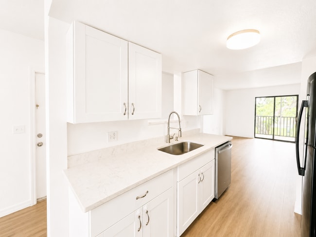 Photo - Updated 2-Bedroom Condo with Screened Lanai with water included.