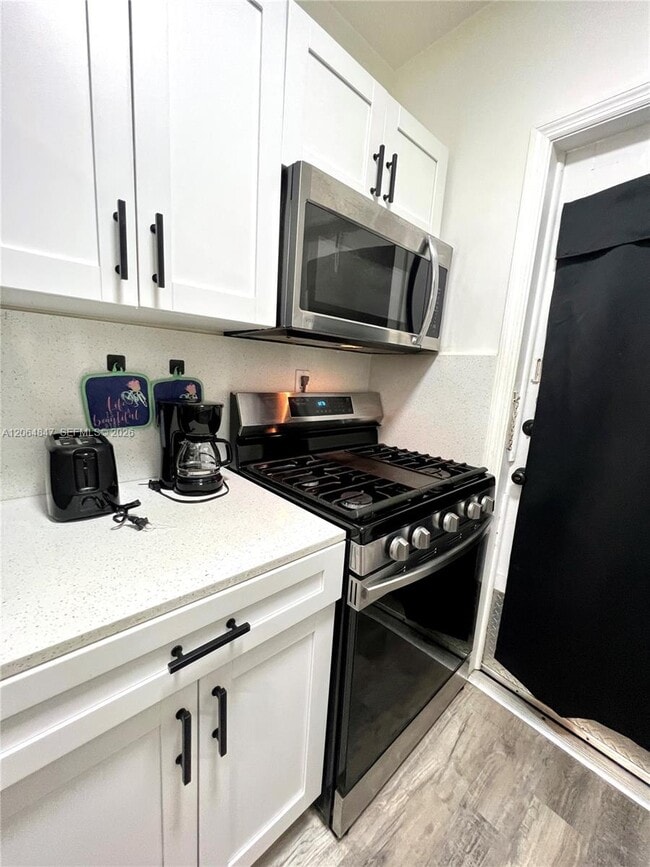 Building Photo - 8132 Harding Ave Unit 3