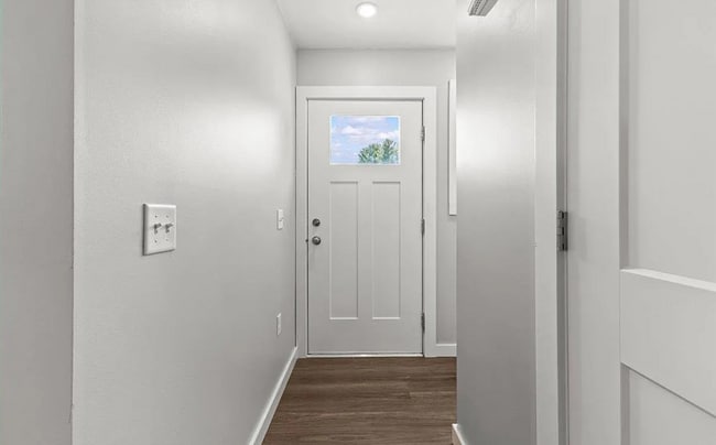 The entryway is bright and inviting, with a small mudroom/coatroom space. - 24 Wilsons End Pl