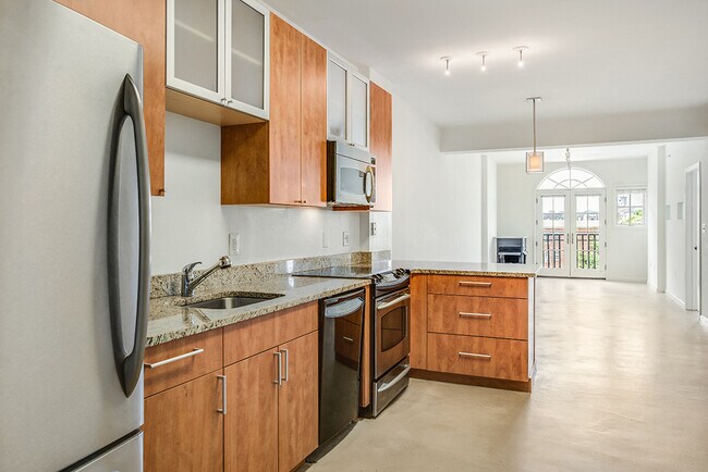 Renovated kitchen with granite countertops and stainless steel appliances - Kalorama Park