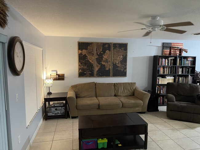 Open-concept 1st floor; view from stairs - 2452 Hassonite St