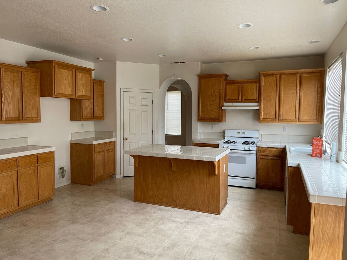 Photo - Spacious two-story home available for rent featuring 4 bedrooms, 2.5 bathrooms, and a three-car g...