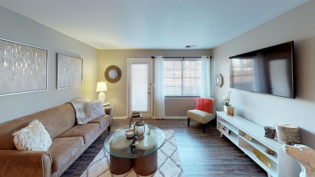 Ample natural light pours in through large windows, highlighting the open concept layout. - Central Park Place