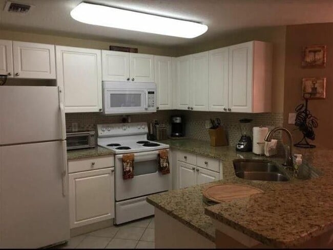 Building Photo - 5080 Fairways Cir Unit G208