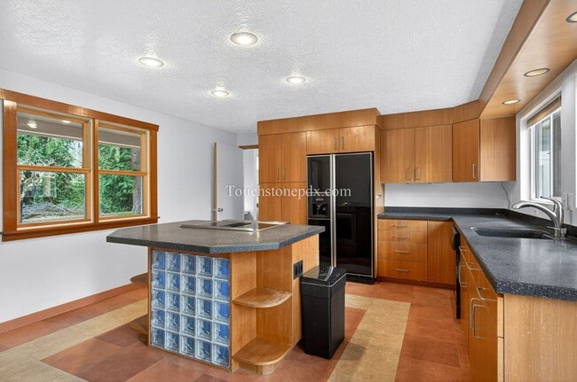 Photo - Spacious 4 Bedroom Home with Large Kitchen, Bonus Sunlit Room, and Deck
