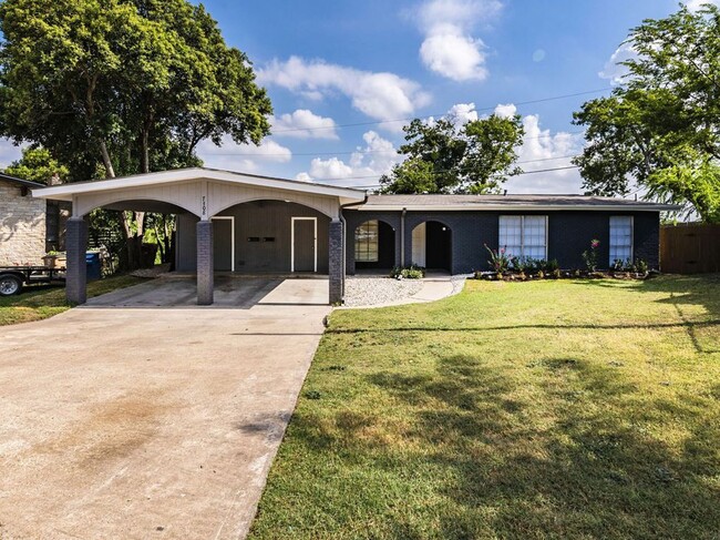 carport and laundry room - 7308 Grand Canyon Dr Apartments