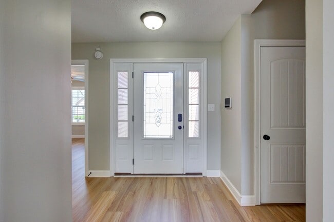 Photo - Fantastic Open Floor Plan Home With Stone Front Fireplace, Stainless Steel Appliances, And Close ...