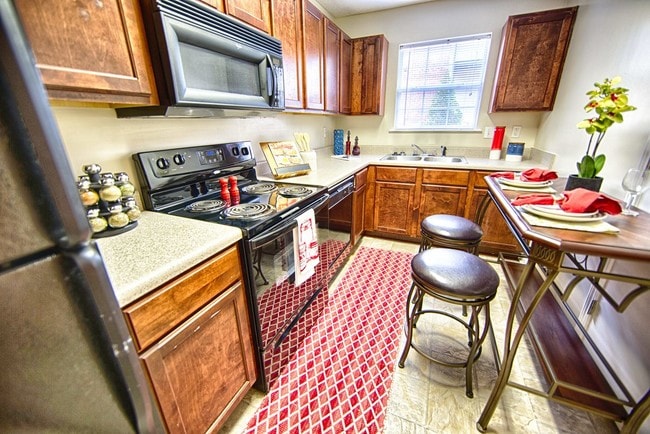 Full Size Appliances in Studio Kitchen with Dishwasher and Garbage Disposal - Forest Trail Apartment Homes