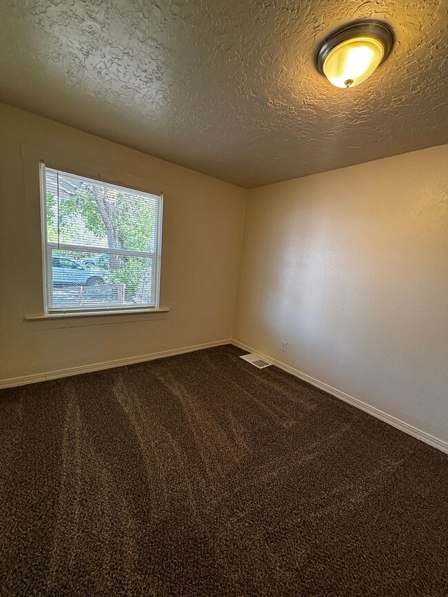 Photo - Quaint home with fully fenced yard and updates