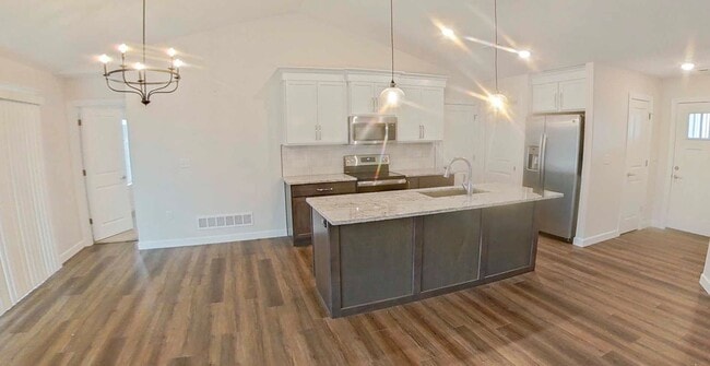 Photo - Newly Built! + Stainless Steel Appliances + 3-Car-Garage + Large Backyard + Washer & Dryer Includ...