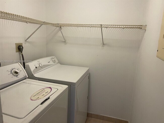 Photo - 9491 Palm Cir S Unit 203