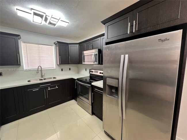 Photo - 7785 W 30th Ct Condominio Unidad F-107