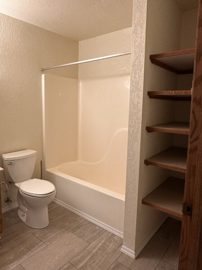 downstairs bathroom with storage area