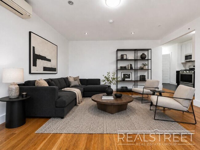 Photo - Stunning 2-Bedroom Apartment at Lofts@QB | Modern Kitchen & Sun-Filled Living Space Unidad 318