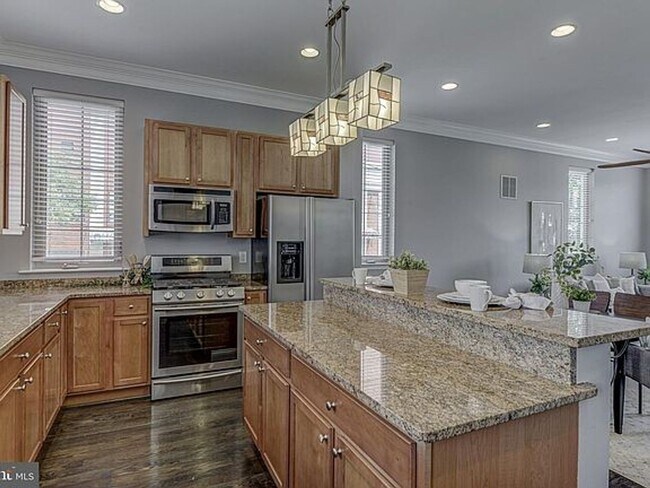 Photo - Beautiful EOG 3 bedroom  2.5 bath townhome with a 2 car garage and roof top deck overlooking the ...