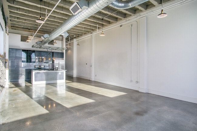 exposed ceiling beams and ductwork add to the builds character - Ideal Building
