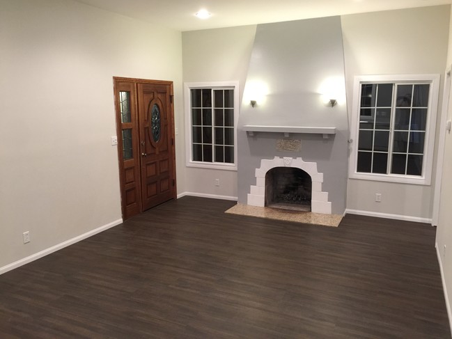 Main entry, living room, and fireplace - 10119 Fernglen Ave House