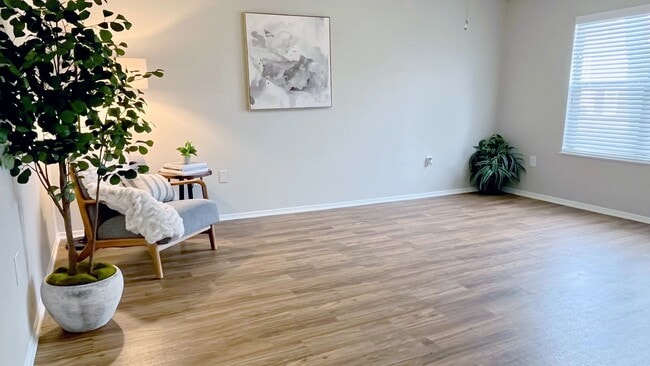 Our generously-sized living rooms with wood-style floors offer the perfect cozy space for relaxation.