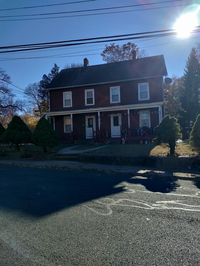 Front of the house. Unit is on the left - 110 Walnut St Townhome