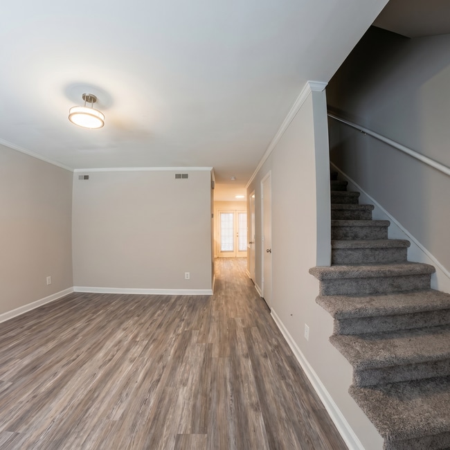 Living Room and Stairs - Courtyard Townhomes