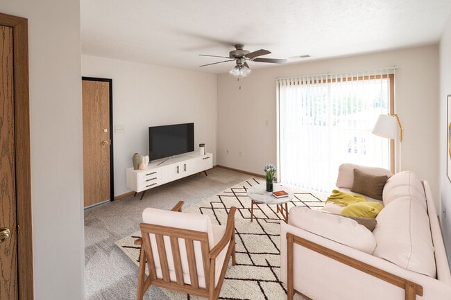 Highland Meadows Apartments in Bellevue, NE Naturally-lit Living Room with Widescreen TV