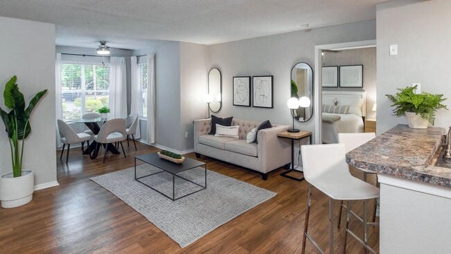This thoughtfully designed living room flows effortlessly into the solarium, creating a light-filled space perfect for both entertaining and relaxing.